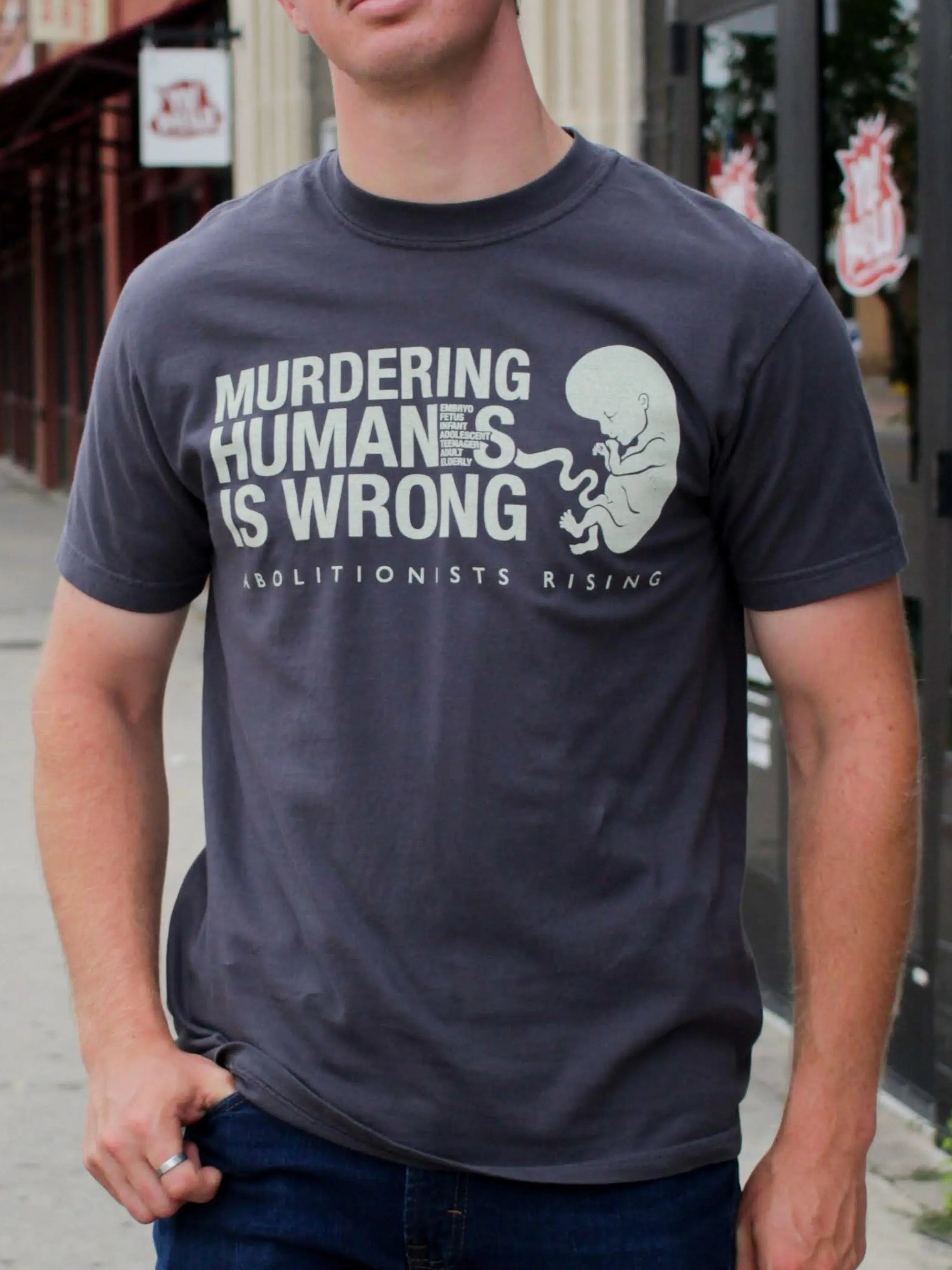 Gray unisex t-shirt with 'Murdering Humans Is Wrong' slogan, Christian anti-abortion apparel for abolitionists Rising supporters and pro-life voters.
Live Action T-shirt
Students for Life T-shirt