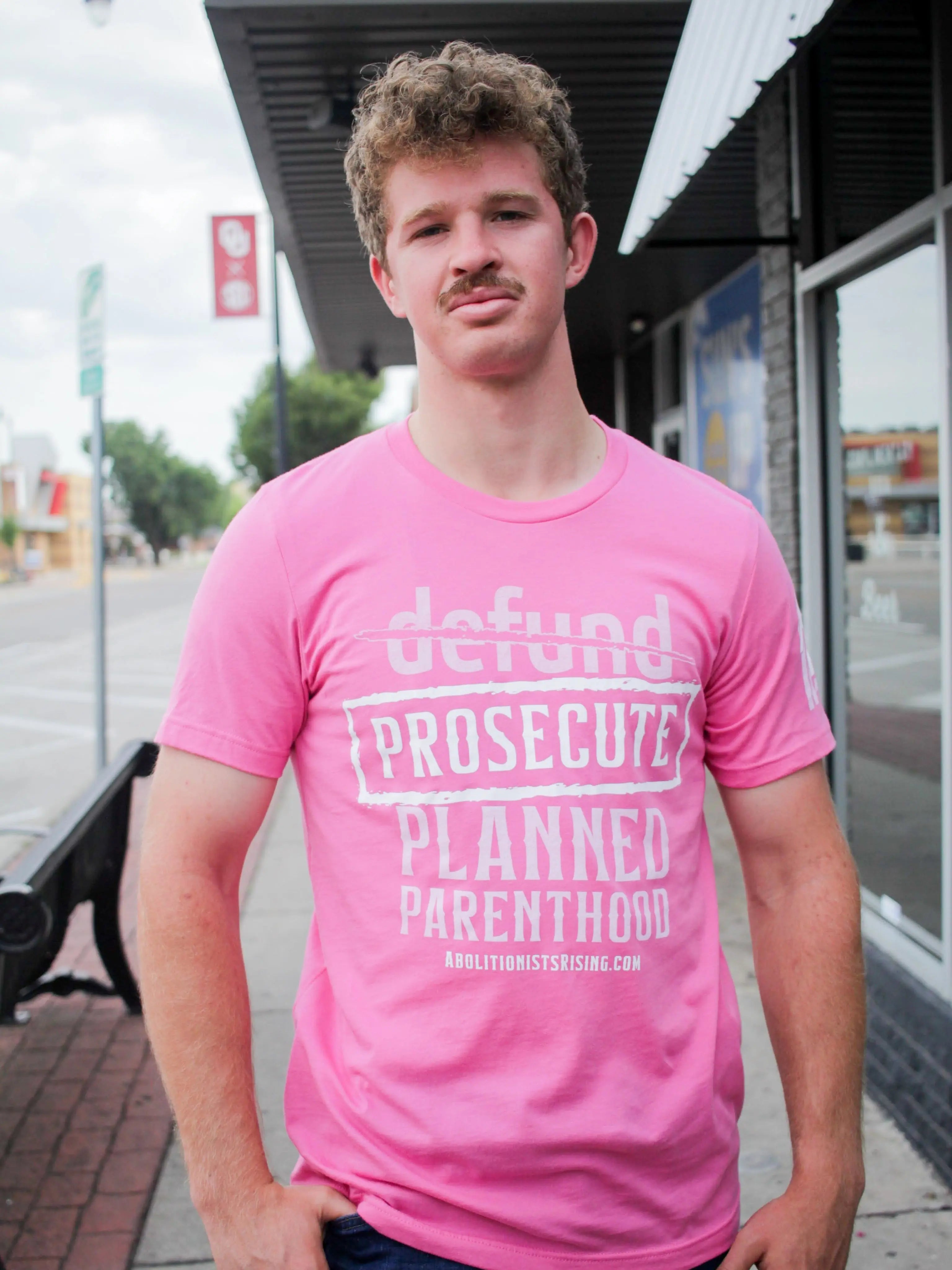 Pink shirt demanding 'Prosecute Planned Parenthood' in white letters, abolitionist pro-life shirt for Republicans and anti-abortion activists like Live Action followers."
Abolitionists Rising T-shirt