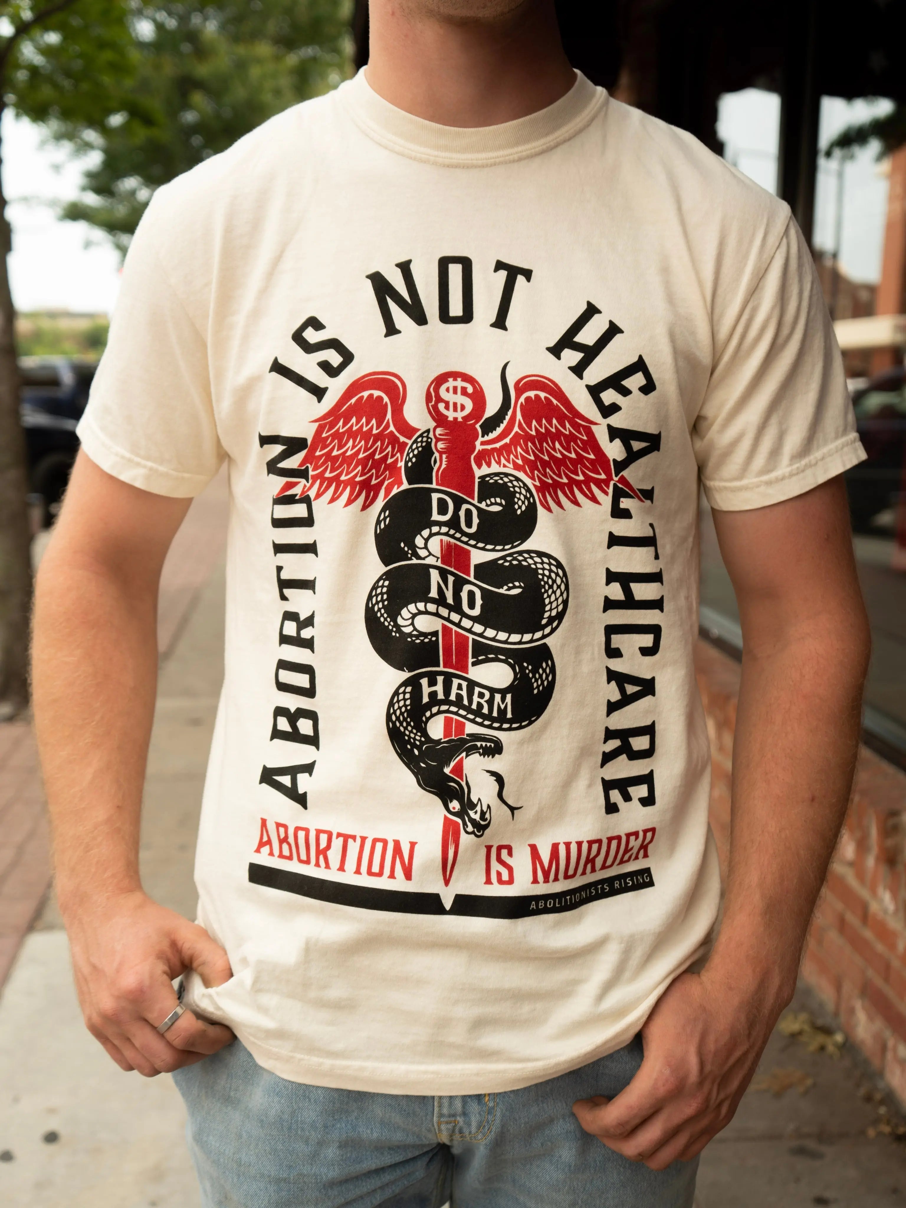 Abortion is not Healthcare Unisex T-Shirt Abolitionists Rising Store