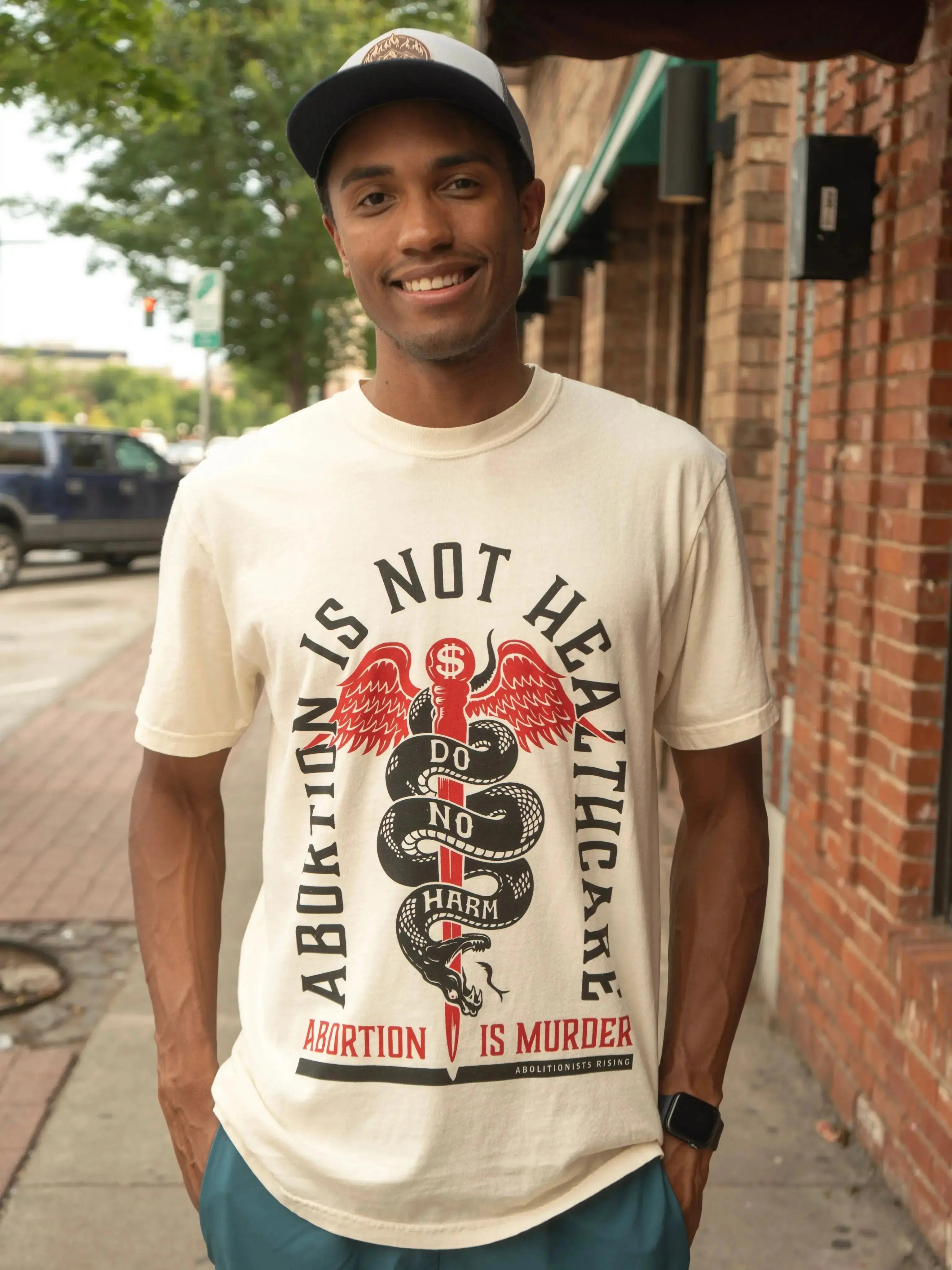 Abortion is not Healthcare Unisex T-Shirt Abolitionists Rising Store