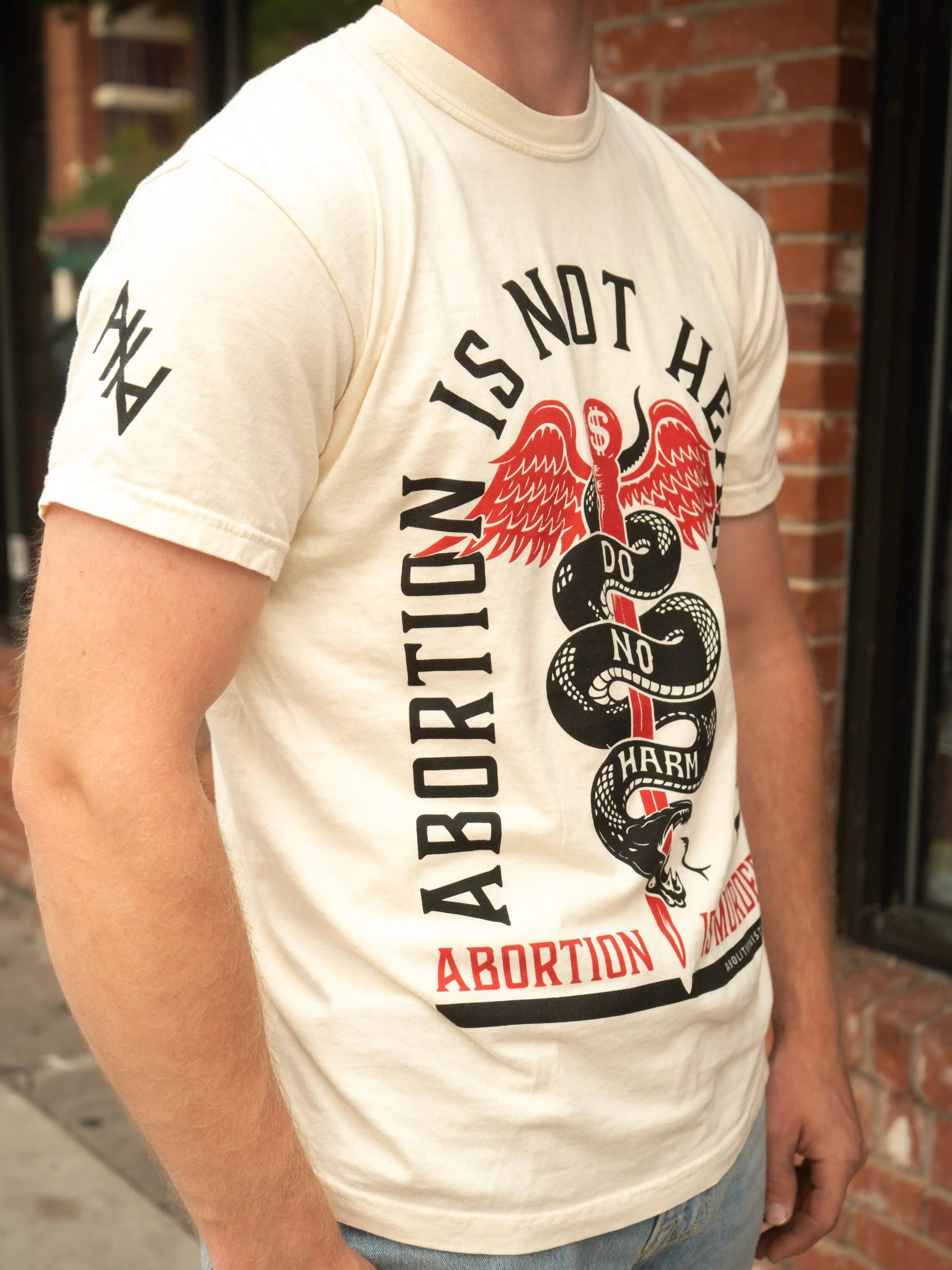 Abortion is not Healthcare Unisex T-Shirt Abolitionists Rising Store