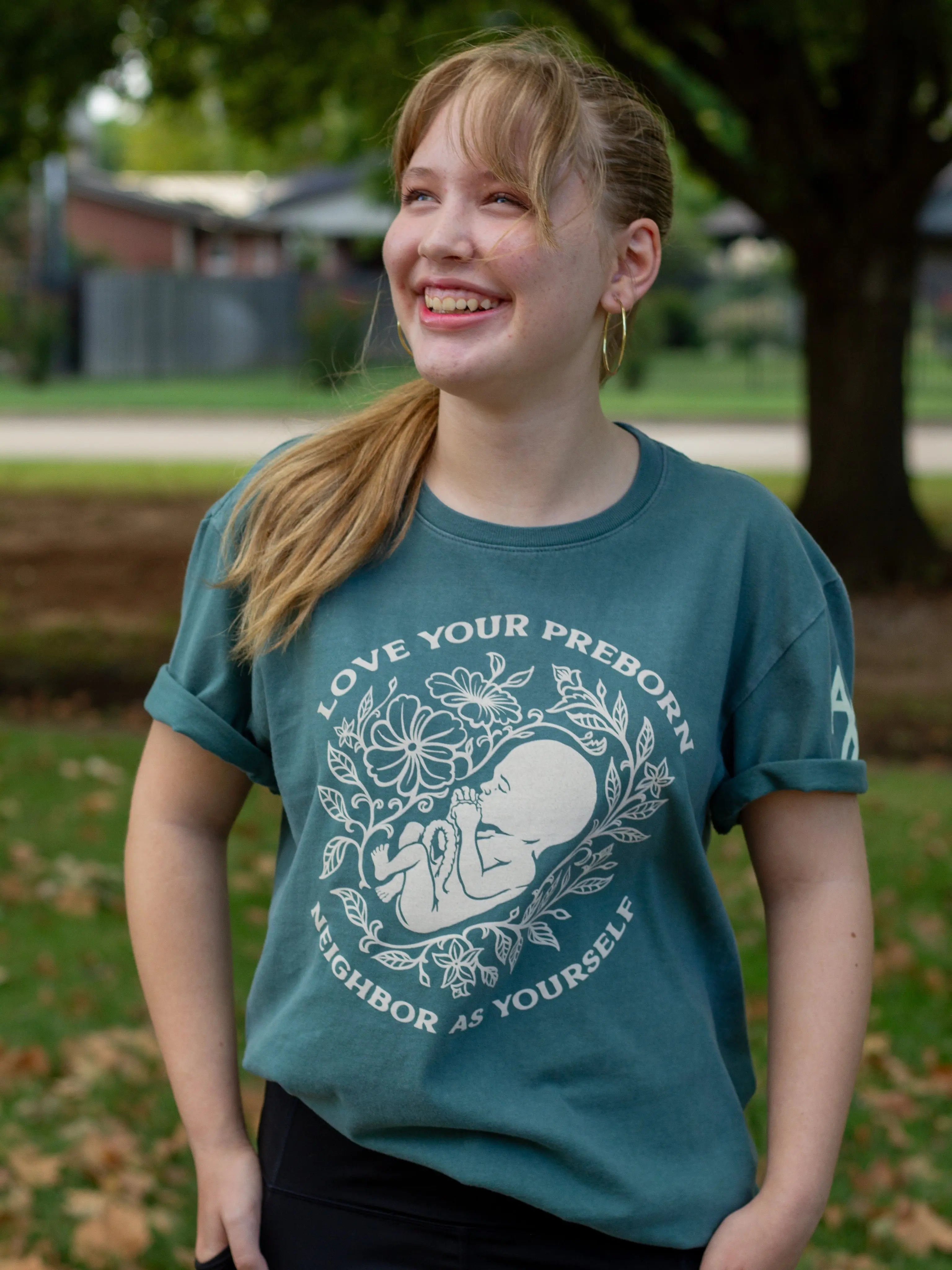 Love Your Pre-Born Neighbors Nordic Green Unisex T-Shirt Abolitionists Rising Store