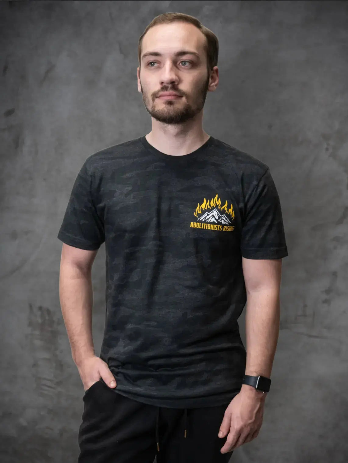 Dark camo unisex t-shirt with Abolitionists Rising logo in white, anti-abortion gear for pro-life and Republicans searching Students for Life or Live Action.